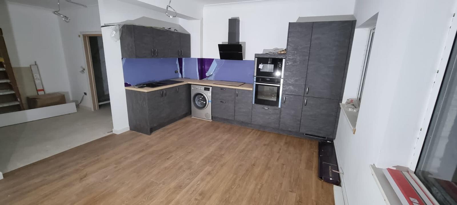 Dark kitchen installation in progress