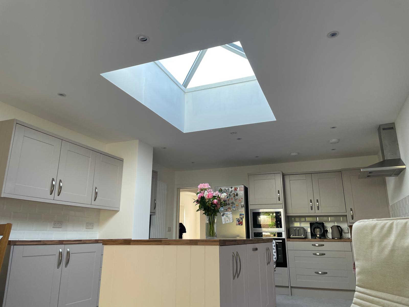 Kitchen with roof lantern and shaker units