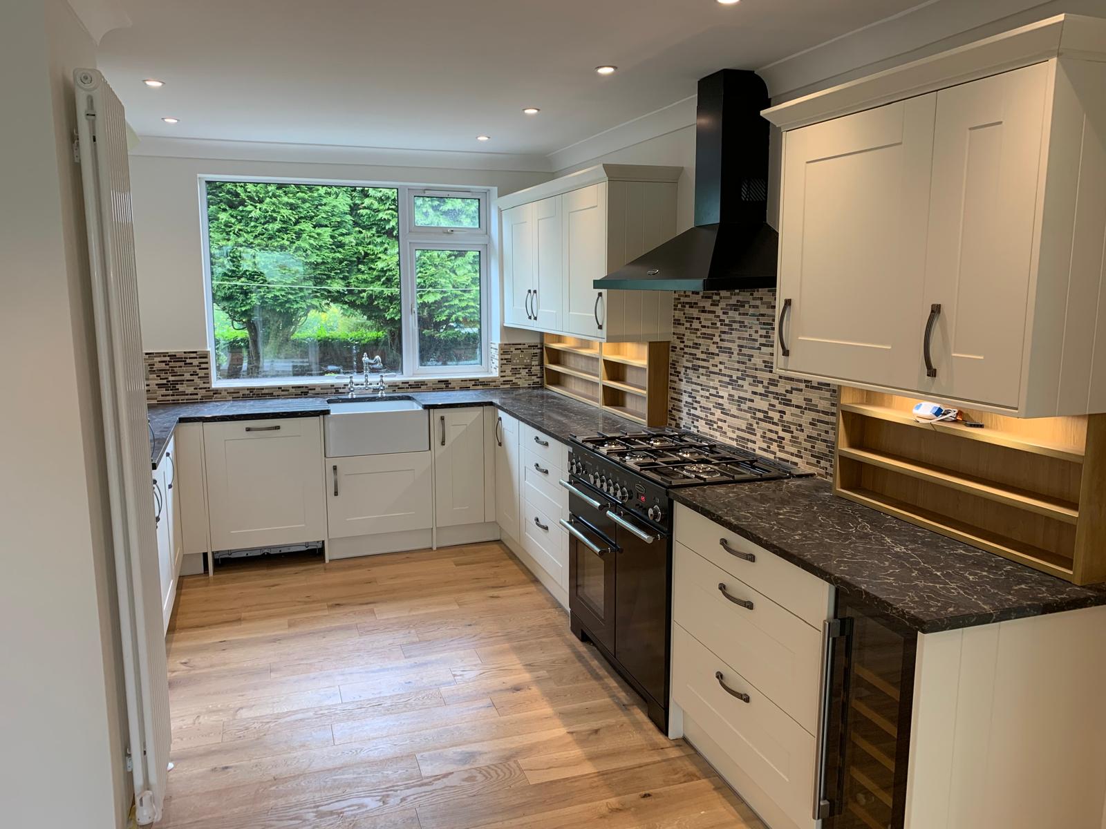 Traditional white kitchen with mosaic backsplash
