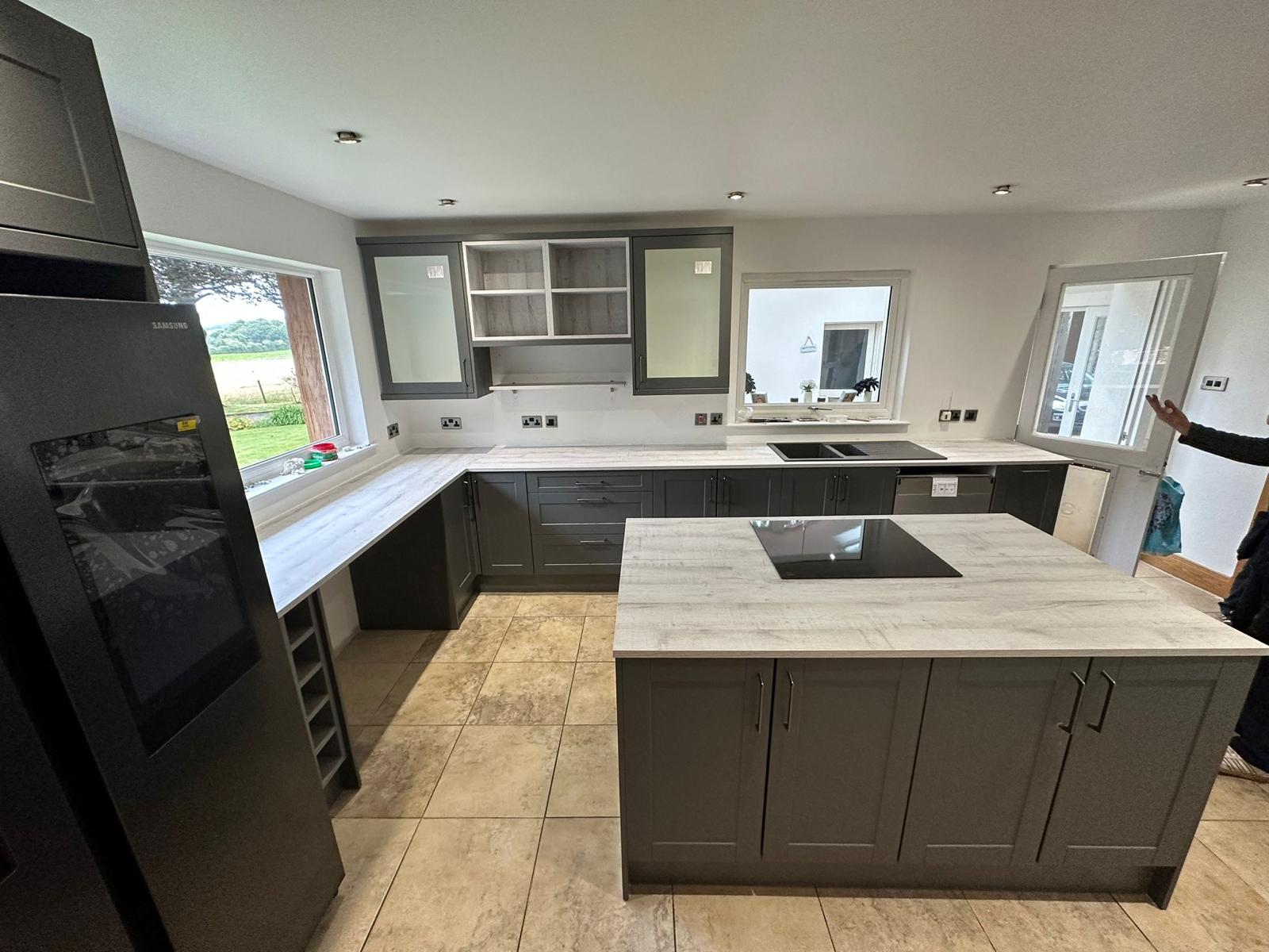 Grey shaker kitchen with marble worktops and island