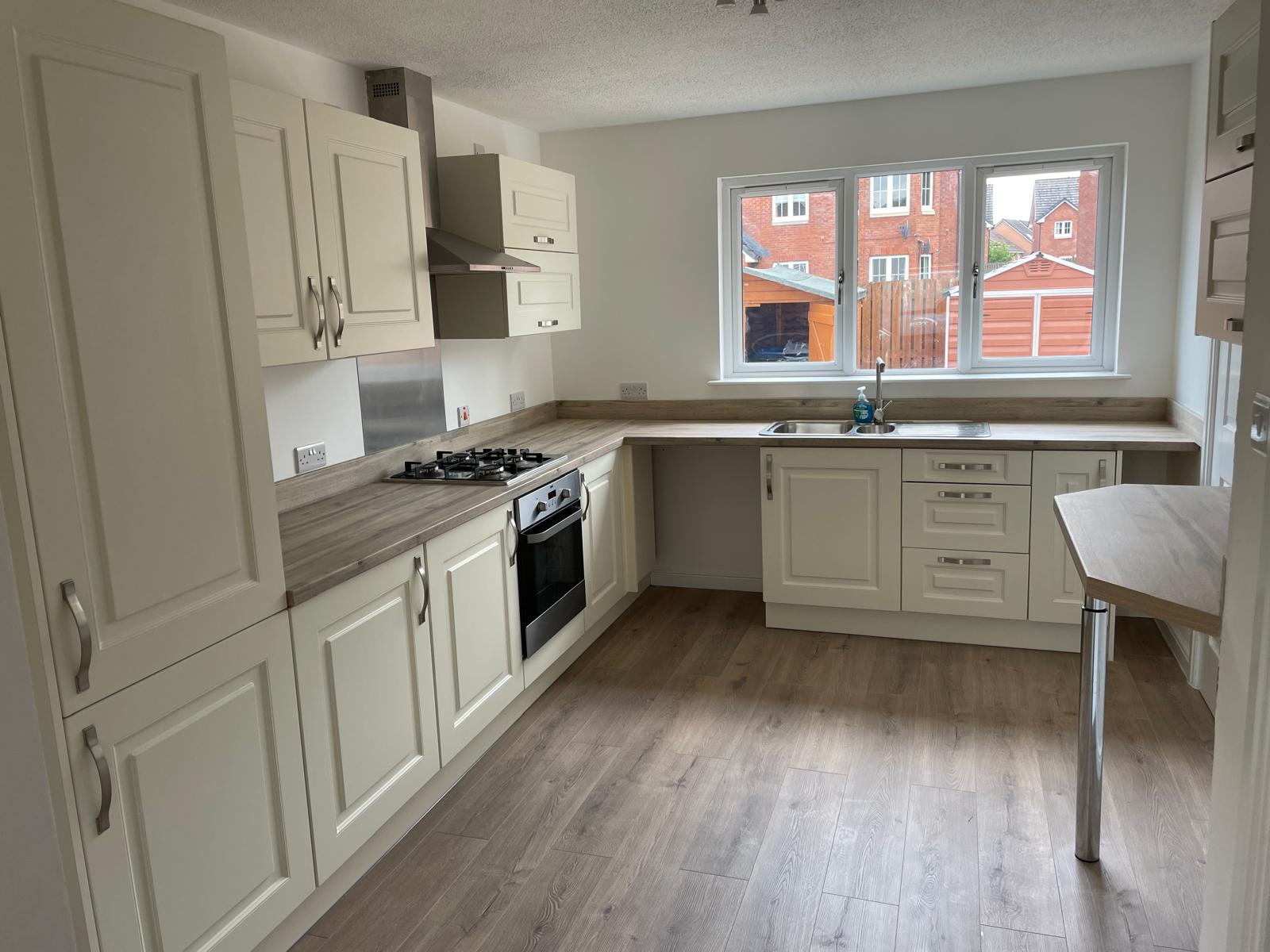Classic cream kitchen with wooden worktops