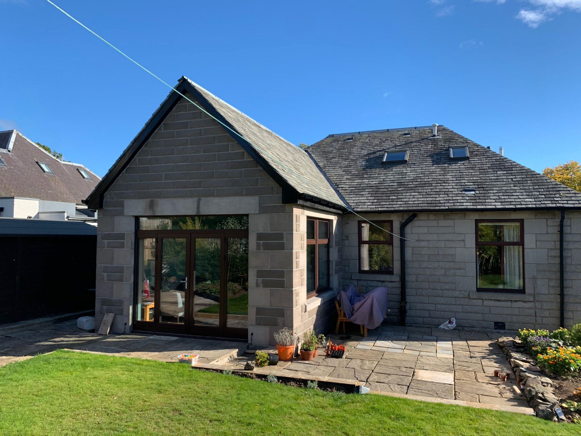 Stone-built house extension with bi-fold doors in Perth