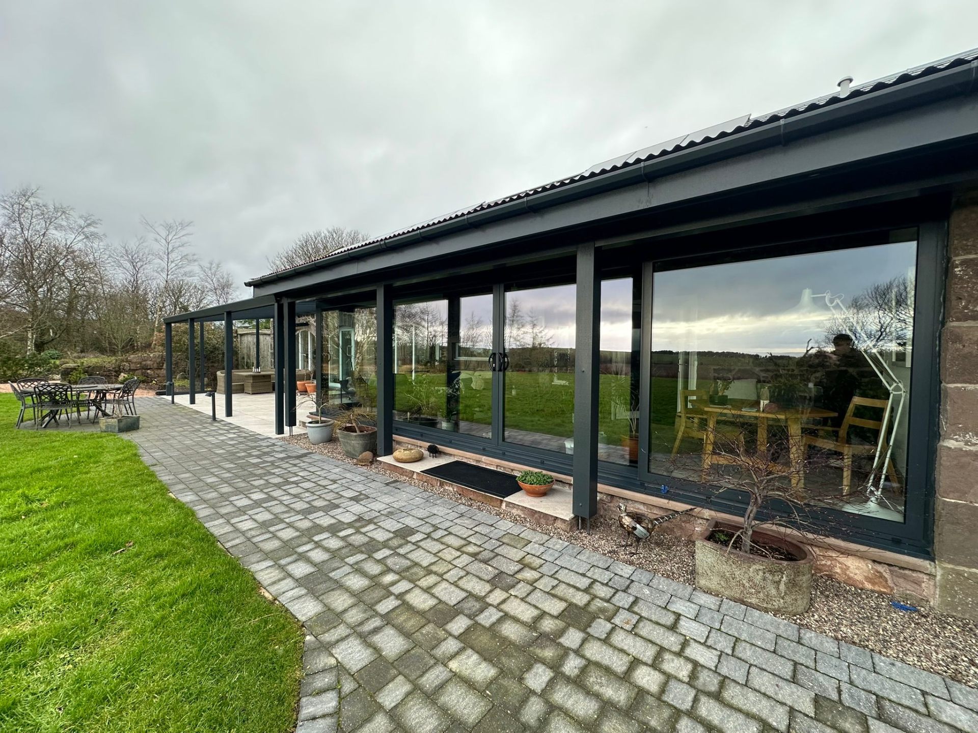 Anthracite grey bi-fold doors on stone property in Perth